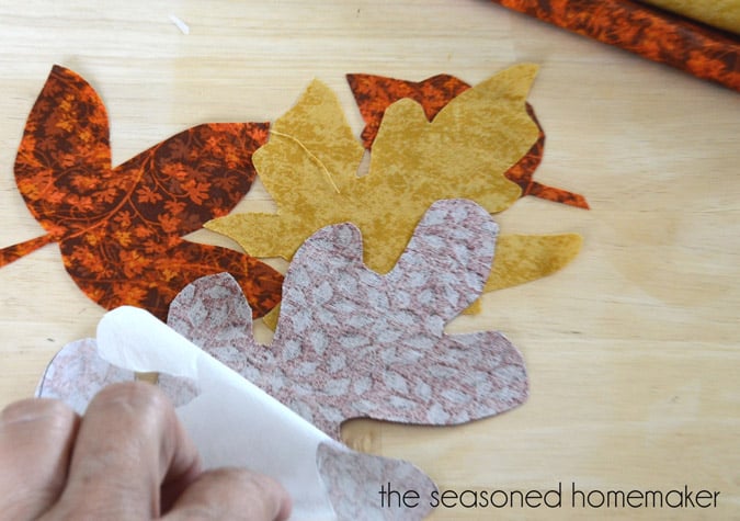 Want a simple way to warm up your Fall table? Try making this simple DIY Fall Table Runner. It’s easy to make and uses inexpensive materials like burlap and fabric scraps. I’ve included easy step-by-step instructions that anyone can follow.