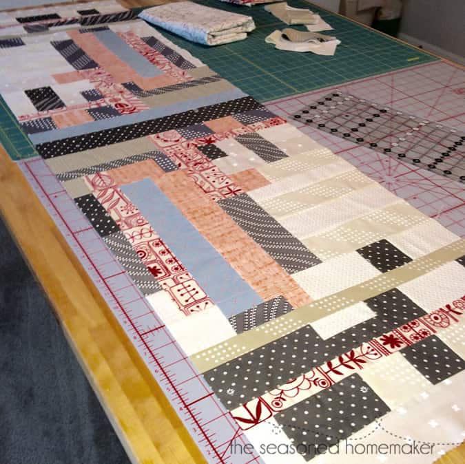 This table runner came about because of a painting I received as a gift. I love the modern geometric design in the painting and was inspired to create this modern quilted table runner using improvisational quilting methods. quilting | modern quilts | improvisational quilts