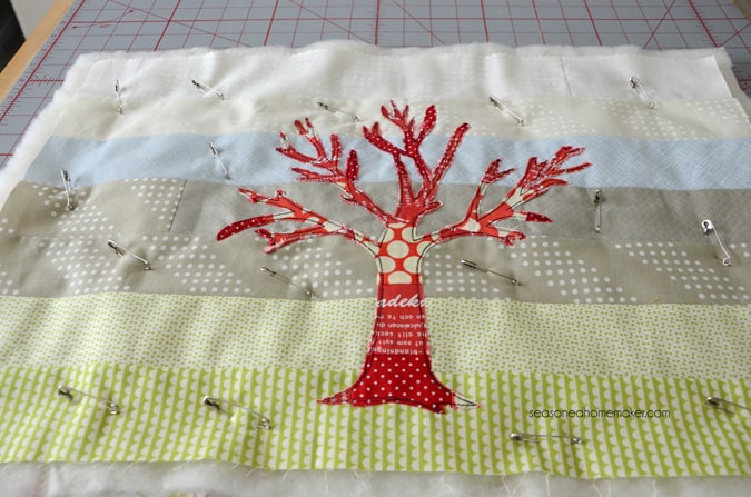 Want a way to use of up those sewing scraps. Applique is an excellent way to embellish a modern quilt. It’s ideal for all sorts of sewing projects. If you can sew a straight stitch then you can make The Red Tree Quilt. The quilt is fast, easy, and can be completed in an afternoon.