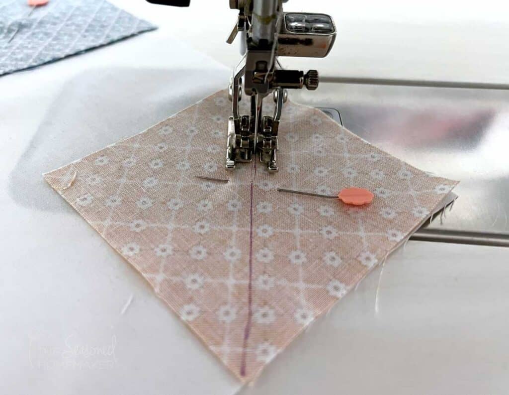 stitch along diagonal line and attaching the square to the snowball quilt block.