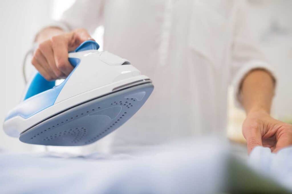 woman ironing starched fabric