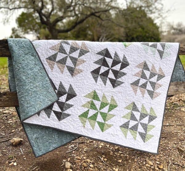 Tumbling Sea Glass Quilt on fence