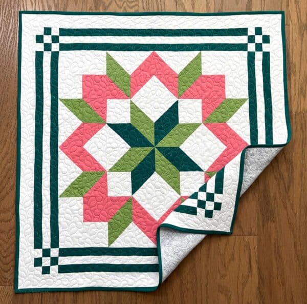 In the Hayloft Mini Quilt in pink and green
