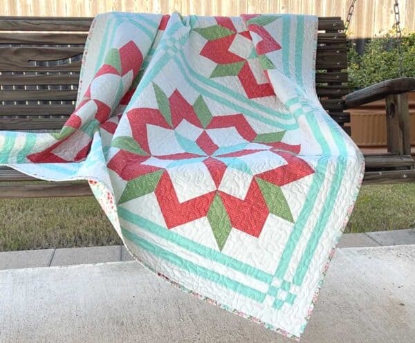 In the Hayloft Quilt Pattern on porch Swing